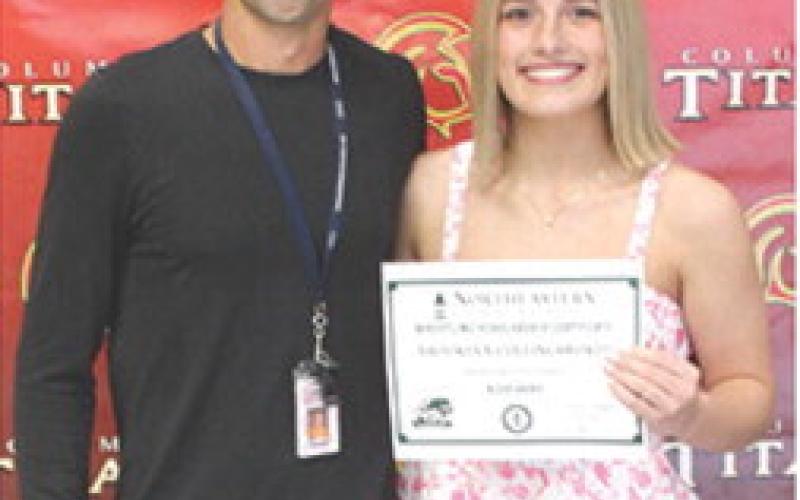 Columbus Titan Head Wrestling Coach presented a four-year wrestling scholarship to senior, Brooklyn Collingsworth from Northeastern (Oklahoma) State University in the total amount of $20,000 during the May 15, 2026 Senior Assembly at the CUHS Gymnasium.