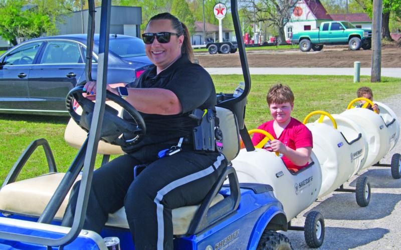 Rhanda Andrews kept busy at the Weir Easter egg hunt driving youngsters around in the Sheriff’s Department train.