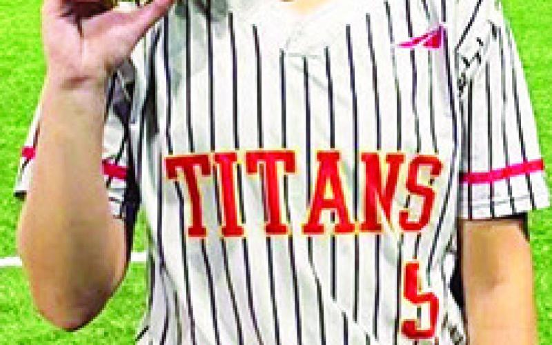Lady Titan Junior, Tatum Kirk, blasted a four-run, grand slam over the left, centerfield fence, to put Columbus on top 15-2, in the top of the sixth inning of the 15-4, game two win over the Lady Trojans in Girard, Monday. The Lady Titans earned the win in game one, 5-4 for the sweep. Courtesy photo.