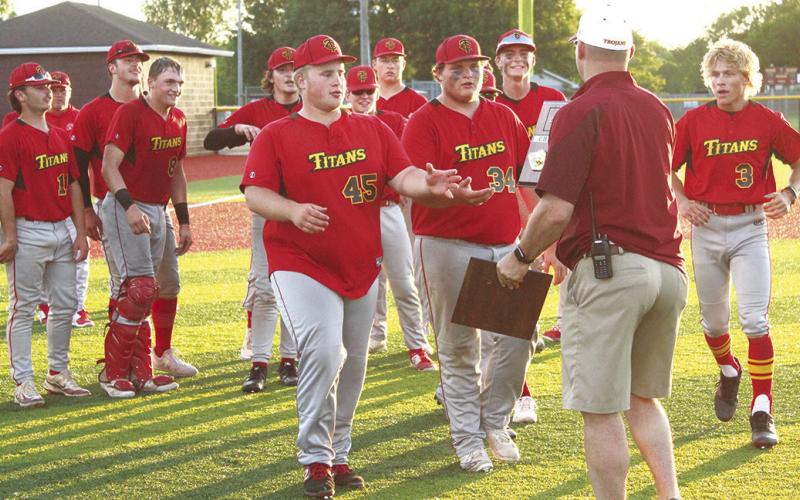 Columbus Titan Seniors, Jake Eddington and Robert Ward, receive the 2023 Kansas Class 3A Regional Championship plaque from the host Girard official, Wednesday, after defeating Frontenac, 9-5, in the championship game. The Titans (20-2, second seed) will face Kansas City-Bishop Ward (17-6), the seventh seed, Thursday, in the Kansas Class 3A State Quarterfinal game at Kansas State University’s Tointon Family Stadium in Manhattan.