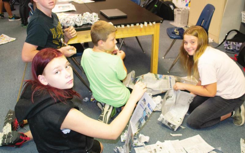 Tower building teaches students metric system
