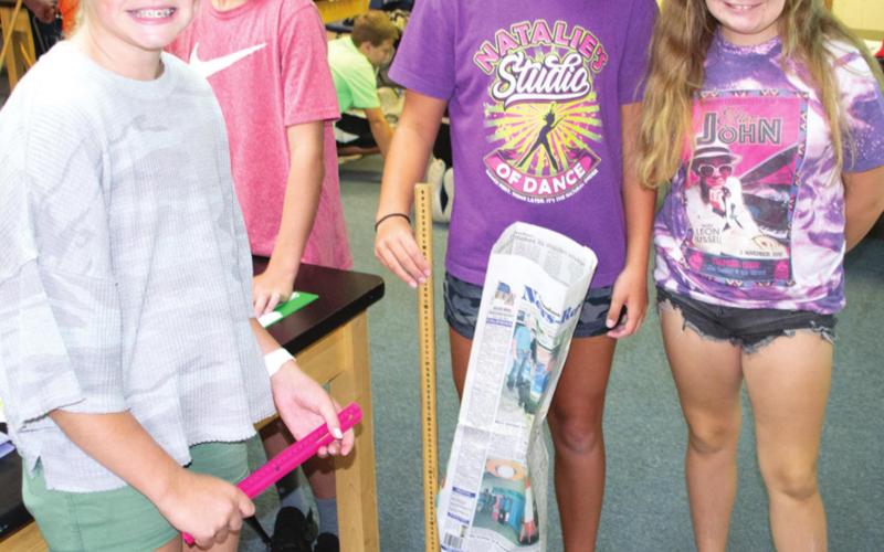 Tower building teaches students metric system