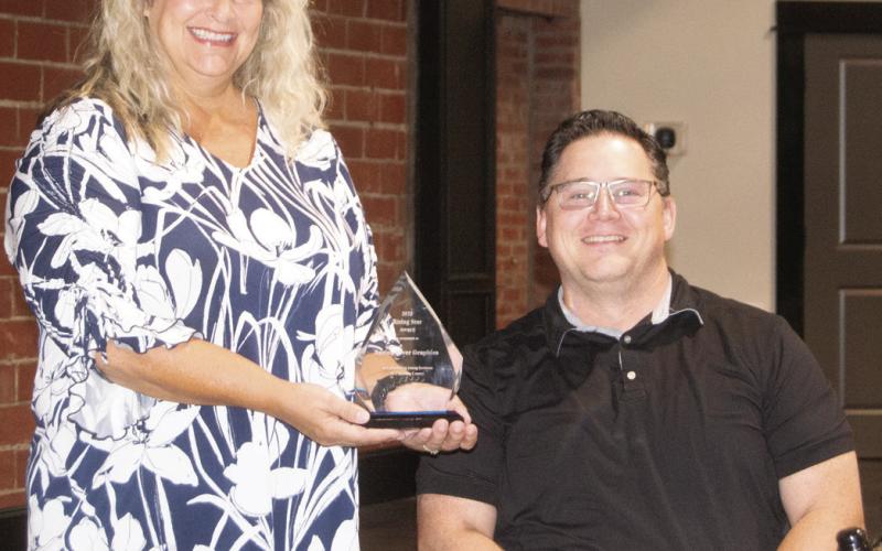 Spring River Graphics received the Cherokee County Economic Development Corporation Rising Star Award. The award was accepted by Pamela Mitchell for the owners. Their impact in the area led to receiving the award.