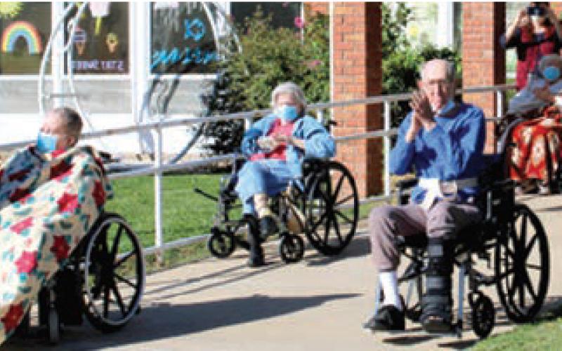 A few residents of Medicalodges were able to sit outside to watch the pep rally put on by students at Columbus High School. COVID restrictions have limited visitors to the facility and the pep rally was planned to lift the spirits of the residents.
