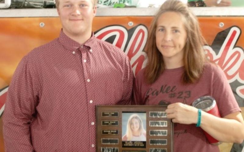 Traveling plaques presented during county fair