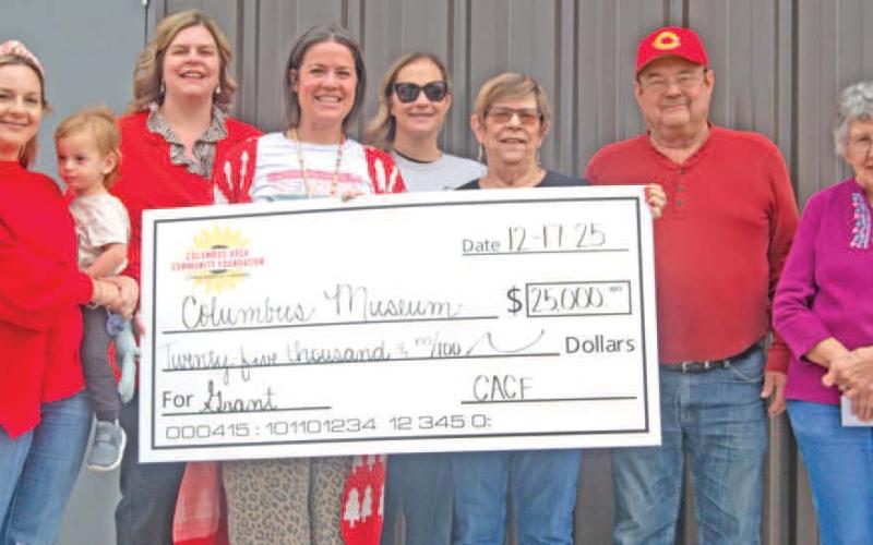 The Columbus Area Community Foundation recently presented a $25,000 dollar check to the Columbus museum for the new sports addition. Columbus Area Community Foundation members Christine Parsons, Jamie Robinson, Kelly Walters, and Maddy Foster were on hand as museum board members Anita Davolt, Ron Holmes and Ella Buzzard accepted the check. News Report photo by Shawn Churchill.