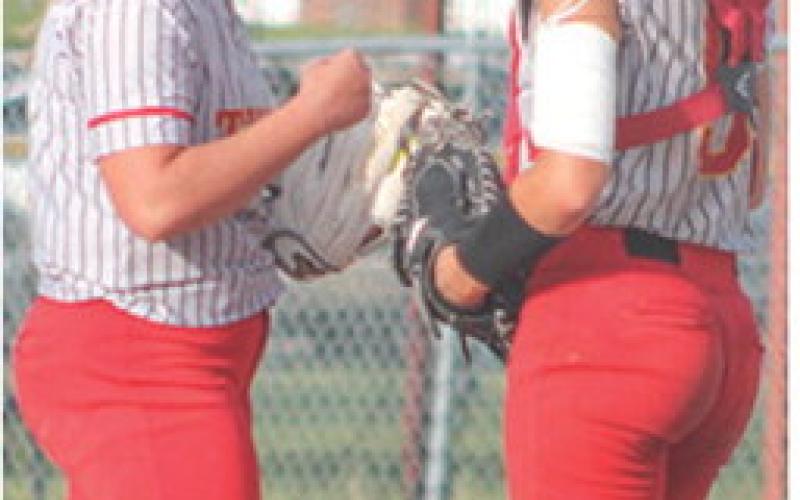Lady Titan Seniors, Morgan Richards, pitcher, and Adalie Grafel, catcher, meet for a conference during home games against Galena, Monday, at Rockette Field in the Columbus Community Ball Park. Galena swept their hosts 15-3 and 11-9 in a CNC League double header.