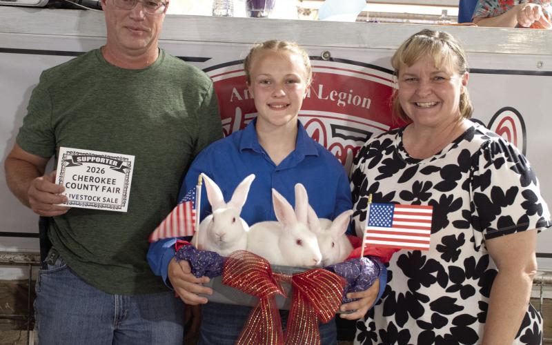 Allison Brown’s Grand Champion rabbits were purchased by Between Rivers Gun Range for $1,500 at the Cherokee County 4-H Premium Sale Saturday night.