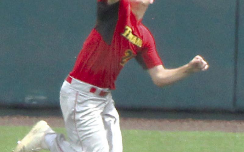 Cole Minor, Titan Center Fielder, makes a run saving catch ini the Kansas Class 3A State Quarterfinal win over KC-Bishop Ward, Thursday. Cole is one of a trio of seniors that includes Kayden Cox in left and Jaspen Tanner in right that have helped the Titans to a record setting season