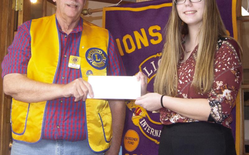 Columbus Lions Club President Brad Gleason recognized Anna Head as Lion of the Month for March at a recent meeting.
