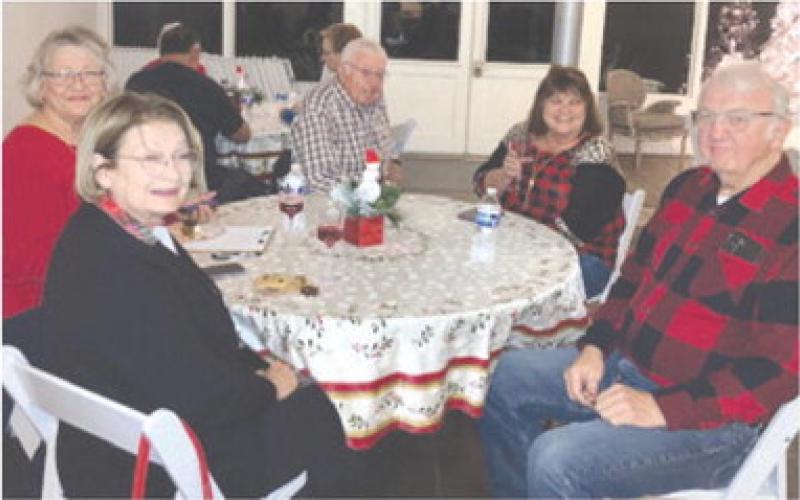 Above and below members of the Cherokee County Democratic Party met at the Old Riverton Post Office for their annual meeting and Christmas party. Tom Pryer spoke to the group about Medicaid Expansion.
