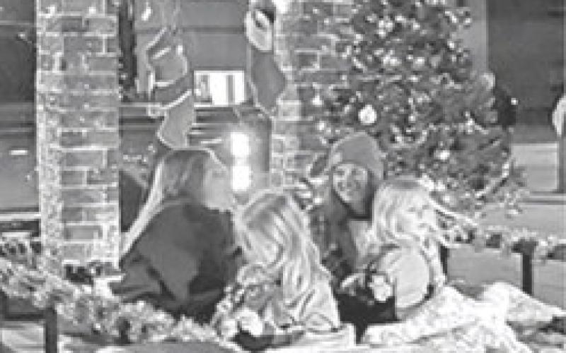 Making sure the stockings were hung by the chimney, the riders of this float were ready for a Merry Christmas at the annual Columbus Parade