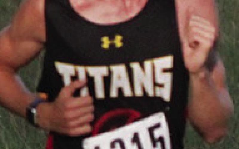 Titan Freshmen, Drake Laurance and Levi Simpson placed eighth and 12th in the Columbus Invitational Cross Country Meet, Thursday, at the Brush Creek Golf Course. The duo is improving on their placings and their times as they near the end of their regular season, Thursday, at Independence. Courtesy photos.