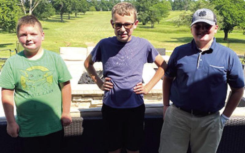 Cajen Smith, Cooper Grundy, and Brayden Boeckman competed in the boys 1112 division of the Columbus Junior Golf, post-clinic tournament, May 31, at the Brush Creek Golf Course, shown in order of finish above. The boys will be back on their home course Thursday for the first tournament on the travel schedule for the season. Courtesy photo.