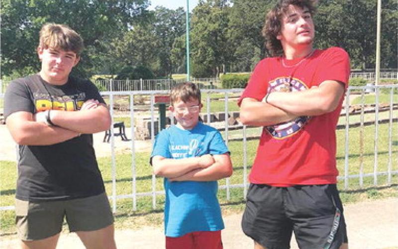 Kash Smith and Jack Vilela pose with their golfing partner following the conclusion of the Special Olympic Golf Tournament at the Pittsburg Golf Course last week. Courtesy Photo.