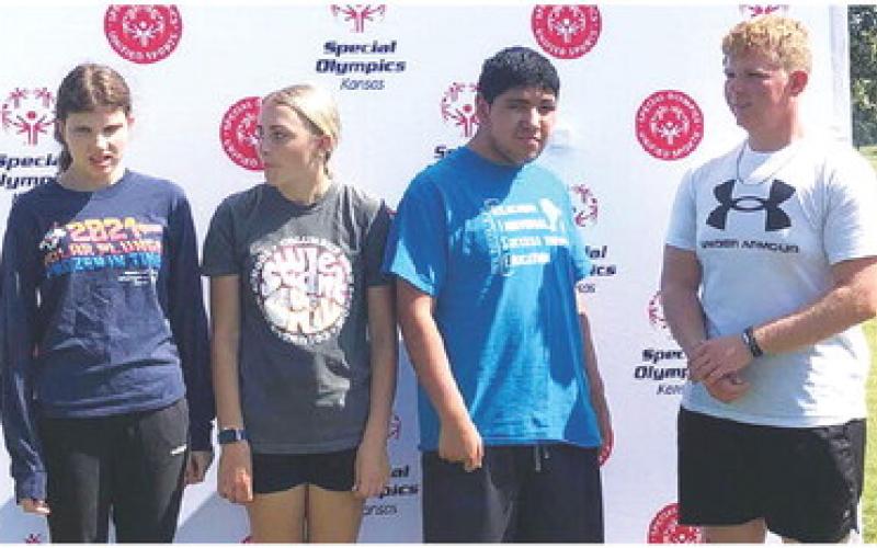 Members of the Columbus Unified High School Student Body participated in the local Special Olympics Golf Tournament held last week in Pittsburg. CUHS Students Mallory Thompson and Kanyen Smith and their golf partners await the recognition on the medal stand following the tournament. Columbus is very active with the area Special Olympics programs. Courtesy Photo.