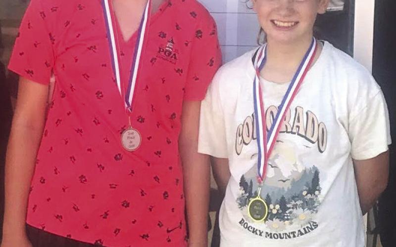 Cami Carpino placed second and Alaina Smiley took first place at the SEK Junior Golf Tournament in Independence, Thursday, in the girls 9-11 age division. Alaina edged Cami by one stroke with a sixhole total of 34 strokes. Courtesy photo.