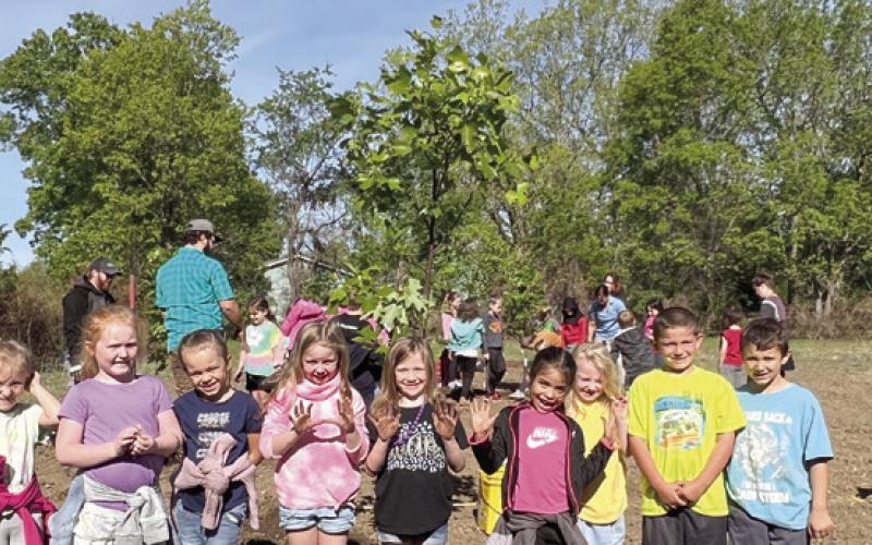 Park Elementary students, Liberty Utilities plant trees