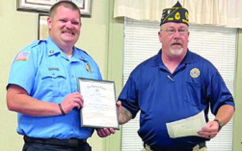 An award for Firefighter of the Year was presented to Baxter Springs Firefighter John Hunt by Baxter Springs American Legion President Daryl Nadeau at a recent meeting. Courtesy photo.