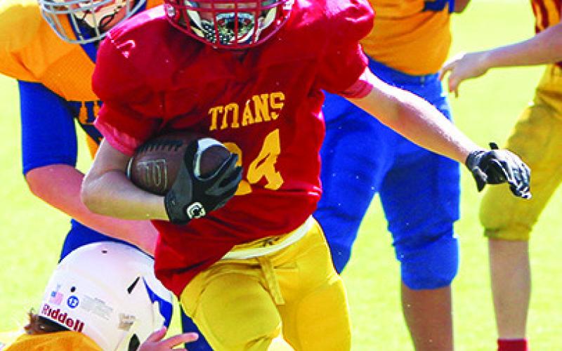 Columbus Titan Elijah Shoemaker, runs against Parsons earlier in the season. Elijah scored at TD in the shutout over Pitt-Rush, 36-0, Saturday, in Pittsburg.