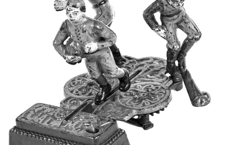 It’s fitting that a mechanical bank called “Calamity,” featuring football players colliding, is rarely found without damage. Surviving examples are rare and expensive.