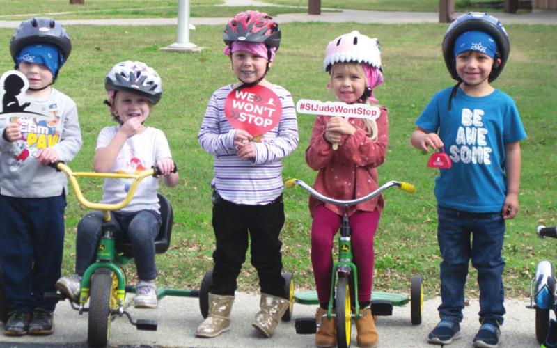 Pre-Kindergarten students ride tricycles for St. Jude