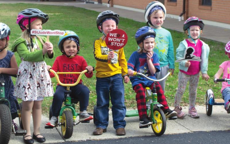 Pre-Kindergarten students ride tricycles for St. Jude