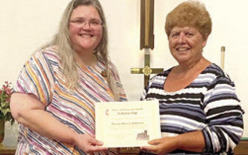 The Starr and Eugenia Smith Scholarship was presented to Pastor Dorcia Johnson by Athena Mc-Colm. Courtesy photo.