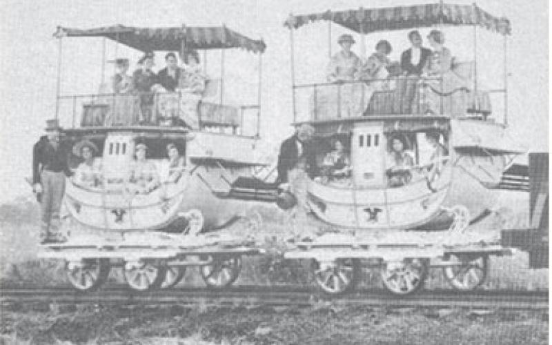 Many of the railway passenger carriages of the 1830s, bore a striking resemblance to the stagecoaches of that period. The bottom looked like a stagecoach and on top was an open-air “promenade deck” equipped with seats and awning, the last word in passenger train luxury.