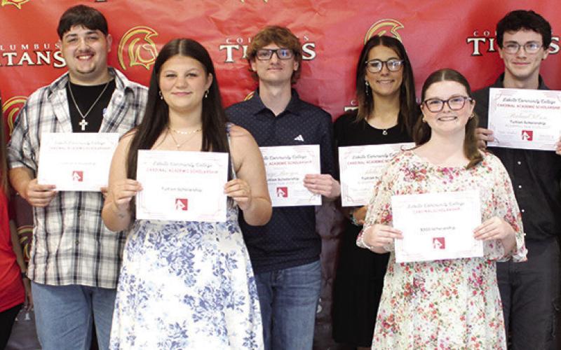 Five Columbus Unified High School Seniors received Tuition Scholarships from Labette Community College during the 2026 Senior Assembly, May 15, at the CUHS Gymnasium. LCC Representatives Elizabeth Kitterman and Mia Howard presented the scholarship certificates to Skyler Saporito, Gauge Buergin, Adalie Grafel, Broland Gibson,and Aubrie Wilson. Kemper Dobkins received a $300 LCC Cardinal Scholarship.