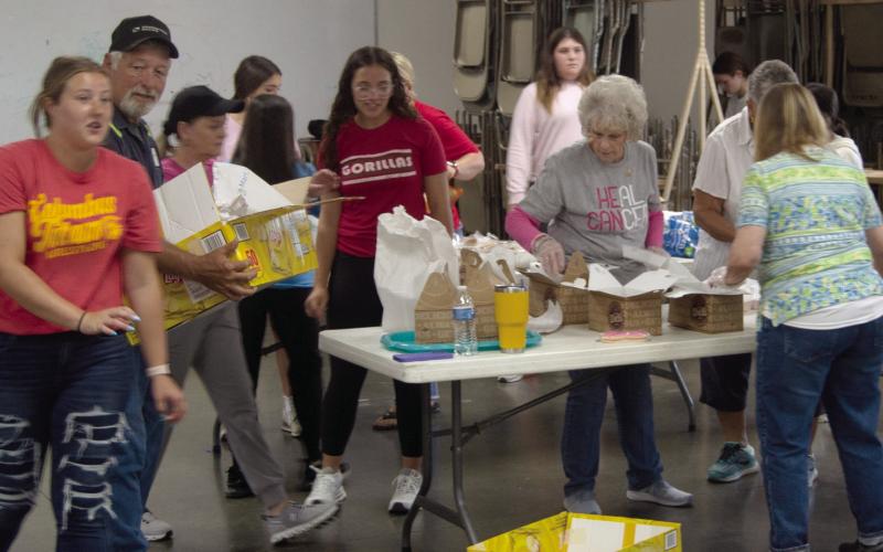 Volunteers at the pulled pork fundraiser for Traci Spear were kept busy filling and delivering orders. A sell out crowd attended the event.