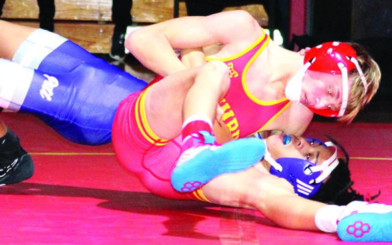 Cal Saporito, Titan Sophomore, pinned his Pittsburg opponent in a dual on his home mats, Thursday. Cal won then 113-pound weight class but Columbus lost the dual, 20-44, to the Purple Dragons at the CUHS Gymnasium.