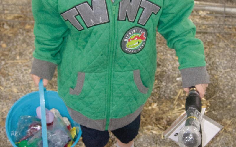 The under five year old grand prize Egg containing the certificate for a scooter was found by Sabastian Lowry, Columbus. Saturday’s hunt was conducted in the 4-H show barns in Columbus with a large turnout.