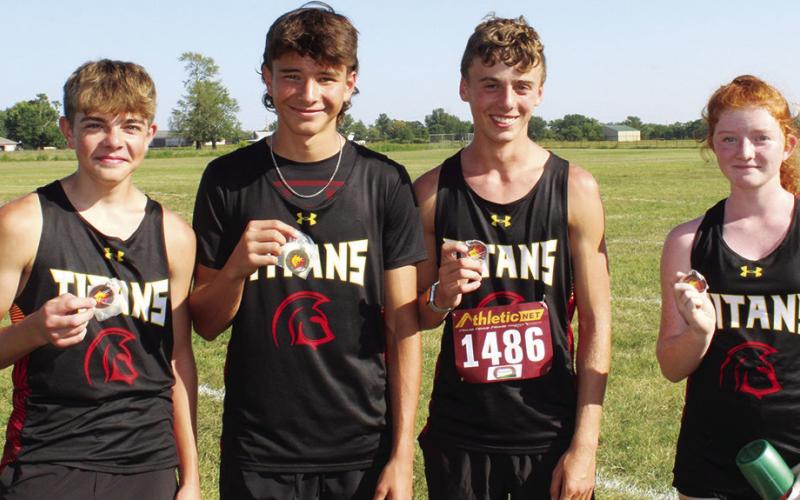 The Columbus Titan Junior Varsity Cross Country Team collected hardware, Thursday as they opened their season at the Labette County meet in Altamont. Freshmen, Easton Long, Drake Laurance, Levi Simpson and Kennedy Reichardt all raced to top 15 places in the junior varsity 5K event. Courtesy photo.