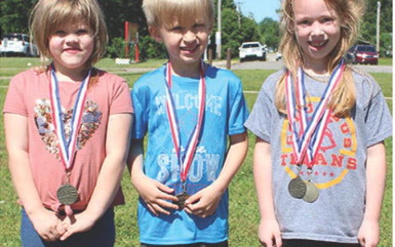 Winners in the ball throw at the Park Elementary Field Day were third place Rylee Zimmer, second place Sasha Romanov and first place Paislee Hodgson