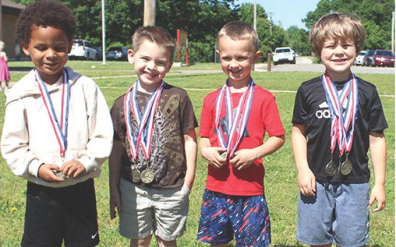 Winners in the long jump at the Park Elementary Field Day were in a tie for second place Zeq Lee, Blaze Elmore and Jax Leet (far right). First place went to Miles Jarrett (red shirt).
