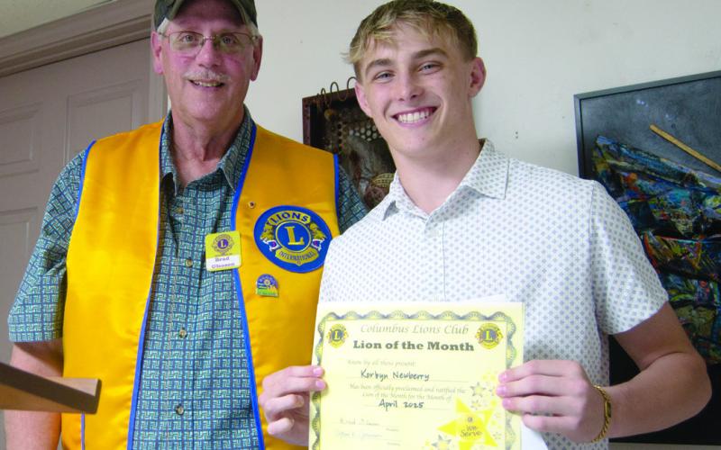 Columbus Lions Club President Brad Gleason presented Korbyn Newberry a certificate in recognition of being the Lion of the Month for April.