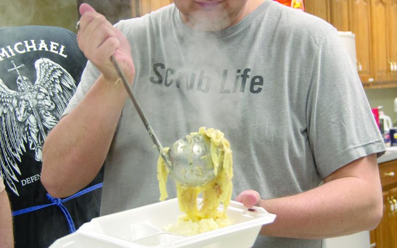 Nate Jameson was dishing up noodles for the Knights of Columbus chicken noodle dinner held at St. Rose Parish Hall Thursday March 12.