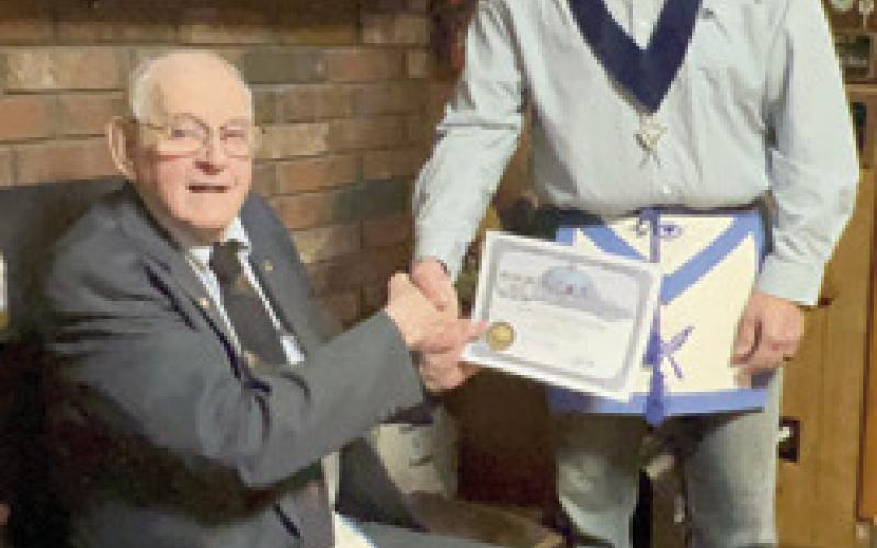 Harold Shideler received his 65 year membership pin and certificate in the AF&amp;amp;AM lodge Tuesday, March 21. Tom Circle, Secretary of Parsons AF&amp;amp;AM #117, presented these to Shideler at his home. There were 15 family members present for the occasion. Shideler became a member of the McCune AF&amp;amp;AM # 232 in 1958. He transferred to Parsons when McCune closed. He filled different chairs and was Past Master twice. He remains a loyal supporter at age 94. Courtesy photo.
