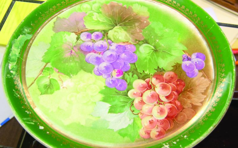 Above a plate recently donated to the Columbus Museum has interesting flaw. Below, the information printed on the back of the piece has the company’s name misspelled. Often antique items can be more valuable if they contain a flaw.