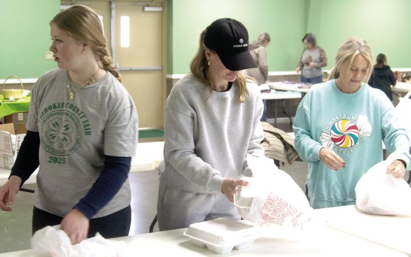 A spaghetti fundraiser was held recently for Eva Maxton. Maxton’s Ewings Sarcoma had been in remission, but has returned and she will be undergoing treatments. All proceeds from the fundraiser will go to benefit the family’s medical expenses. Violet Huddleston, Katie Huddleston and Michelle Mosler were packaging to go orders for pick up and delivery. News Report photo by Shawn Churchill.