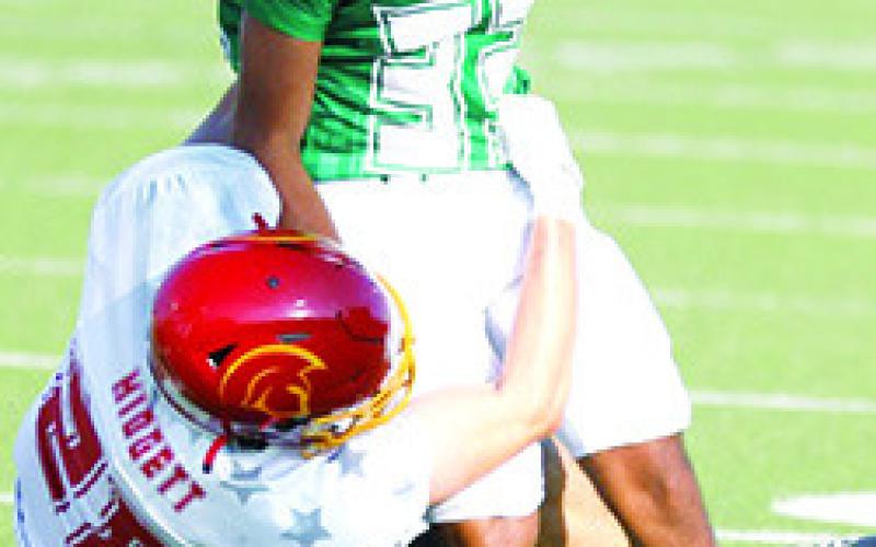 Columbus Titan 2023 Graduate, Landin Midgett, playing for the East Team brings down a West player during the 50th Annual Kansas Shrine Bowl All-Star Game, Saturday, in Hays. The West Squad held off a late charge by the East Team to take the win, 2120, late in the fourth quarter. Photo by Rick Peterson Jr./KSHSAA Covered.