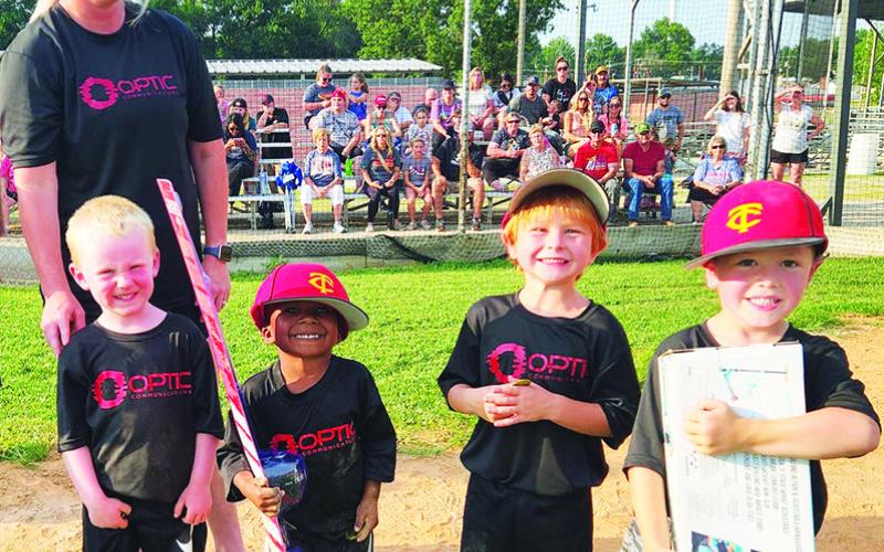 Members of the Optic Communications Team, Brody Eaton, Miles Reeves, Jovey Roberts, and Brooks Crain received their participation medals for the 2023 Cal Ripken T-Ball Season at the league’s closing ceremony, June 27, in the Community Field Ballpark. Miles received a fishing pole and Brooks a scooter in the fundraising drawing. Bronson Dainty was not present at the event. Mike and Miranda (pictured) Eaton and Jake and Brenna Dainty coached the team.