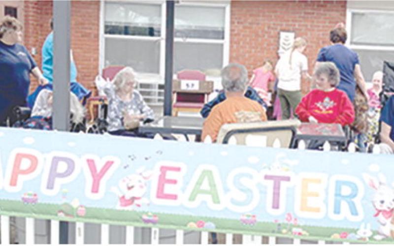 Residents and staff of Medicalodges in Columbus enjoyed the fresh air as they watched the children search for eggs at the annual Easter egg hunt sponsored by the facility.