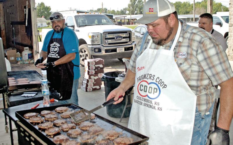 Farmers Co-op employees were busy frying hamburgers to fill the bags in recognition of the first responders in Cherokee County. Chefs Josh Green, Mike Soper and Matt Case fried more than a hundred burgers for the event