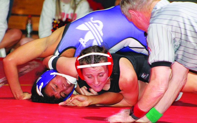 Senior, Katie Simpson, took a win by pin over her Lady Purple Dragon opponent in the home dual, Thursday, at the CUHS Gymnasium. Columbus won the dual, 51-18, over their guests from Pittsburg.