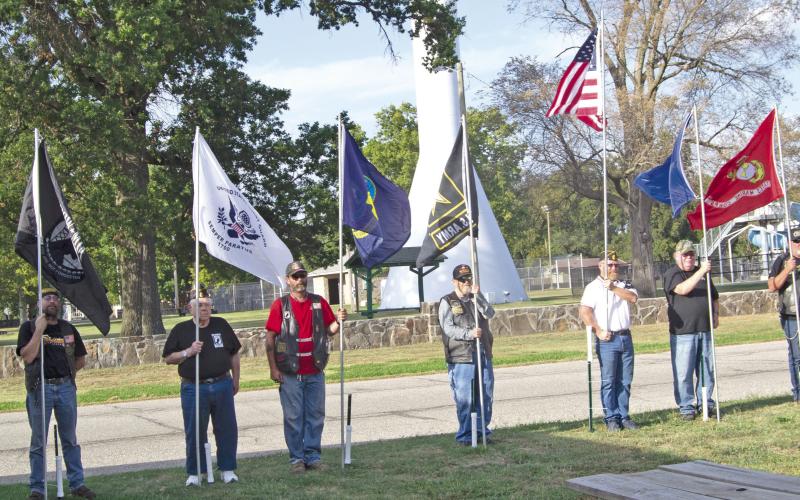Wayne Dobkins ,Dewey Smith, Jesse Pryor, Aron Davolt, Randy Bass, Mike Wahl, Steve Jameson, Martinez and Chuck Dawe (not in order) were among those holding flags representing the various armed services during the annual Watchfire ceremony held September 17.