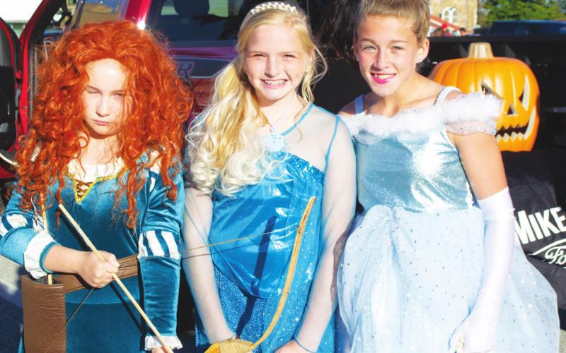 Amory Neely, Landrey Perry, and Tatum Kirk attended this year’s Halloween Trunk or Treat event in Columbus dressed as Disney Princesses. Their attention to detail garnered much attention from fellow attendees, complete with props and jewelry accessories as added touches. Photo by Jacob Spencer