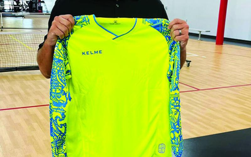 Brandon Rowton delivers youth soccer goalie jerseys to the Columbus Area Youth Soccer Program. Rowton and wife, Carly Hill Rowton, both products of the organization, donated multiple sizes, replacing some league jerseys as old as 27 years. Courtesy Photo.