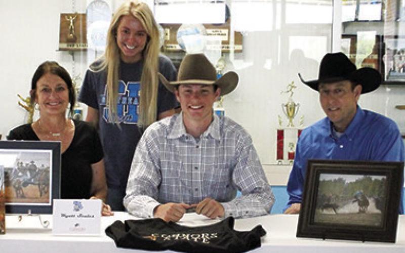 Wyatt Scales, Southeast Senior, signed a letter of intent to compete at the next level with the Connors State College Rodeo Team. Witnessing the signing at Southeast High School are his parents, Shandi and Mark Scales and sister, Amber Scales. Courtesy Photo.